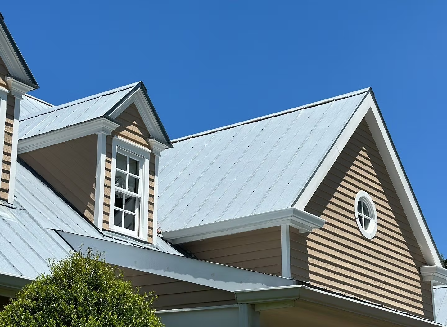 Screw-down metal panel roofing