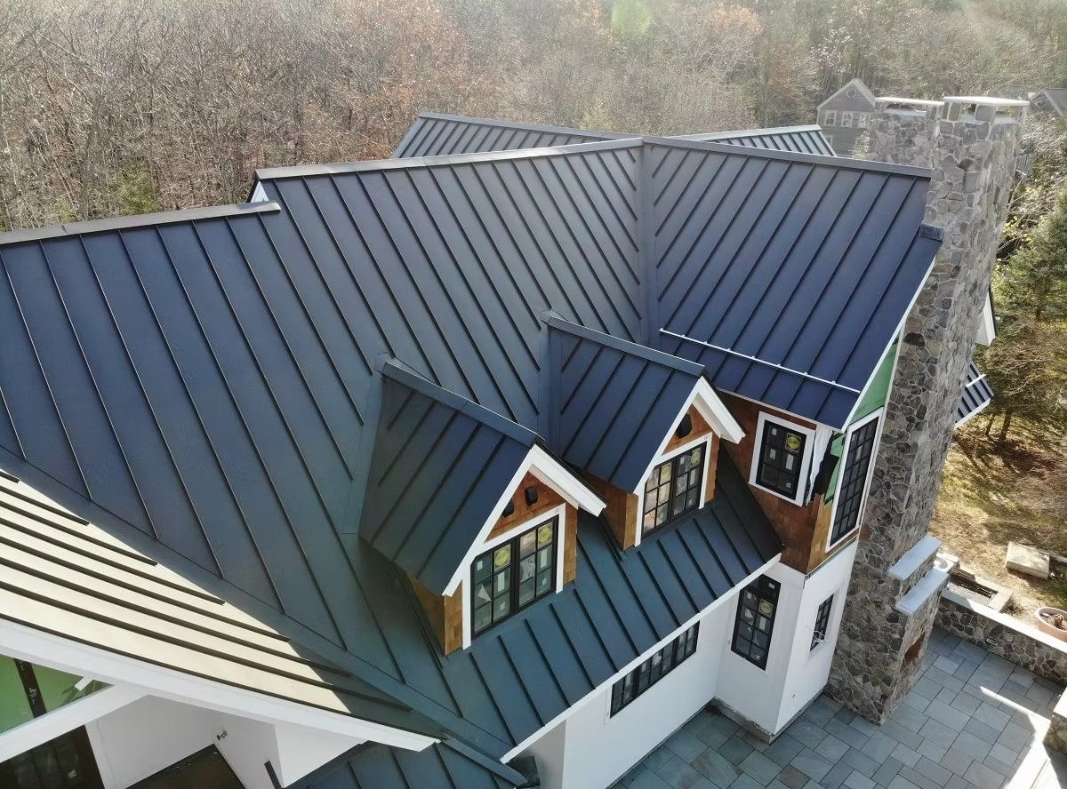 Standing seam metal roof showing Galvalume and painted finishes